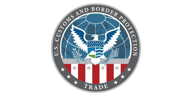 Logo der U.S. Zoll- und Grenzschutzbehörde Handel mit einem blauen Kreis mit einem weißen Stern, einer weißen Taube mit ausgebreiteten Flügeln und dem Text "U.S." über der Taube.